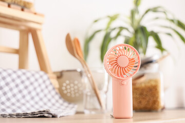 Mini fan on counter in kitchen, closeup