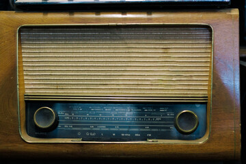 A view of very colorful antique broadcast radios from different eras