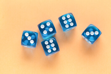 Blue game dices on orange background