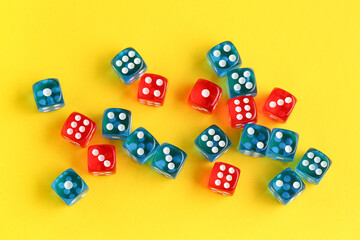 Different game dices on yellow background