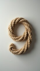 Obraz premium Rope forming the number 9 on plain white background