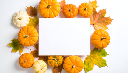 Fototapeta premium Autumn Arrangement Featuring Vibrant Orange And White Pumpkins Surrounded By Colorful Autumn Leaves