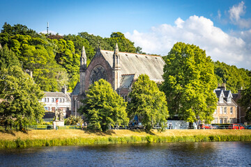 church on banks of river ness, inverness, scotland, uk