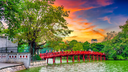 Red Bridge- The Huc Bridge in Hoan Kiem Lake, a lake in the historical center of Hanoi, the capital city of Vietnam © huythoai