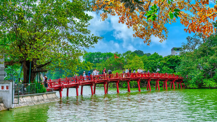 Red Bridge- The Huc Bridge in Hoan Kiem Lake, a lake in the historical center of Hanoi, the capital city of Vietnam © huythoai