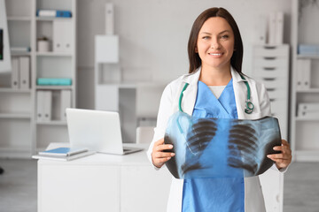 Female doctor with x-ray image of lungs at hospital
