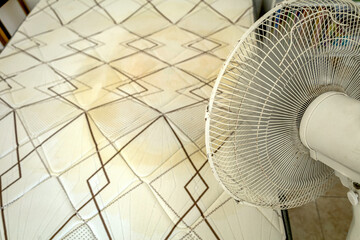 Drying a mattress peed on by a small child with a fan at home. Drying method for removing moisture...