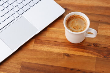 Laptop with cup of coffee

