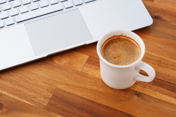 Laptop with cup of coffee
