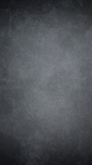 Obraz premium Dark gray textured background with subtle variations in shade and a vignette effect