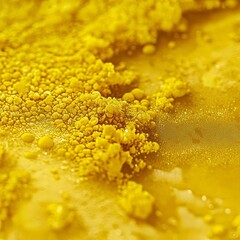 closeup of nutritional yeast sprinkled over surface yellow flaky texture macro plantbased food supplement clean background