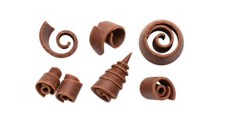 Collection of various chocolate curls and swirls, isolated on transparent background, used as a garnish for desserts and pastries