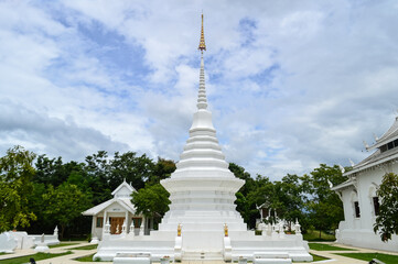 Fototapeta premium White Pagoda and White Church, Lanna Architecture, Symbols of Buddhism, South East Asia at Wat Thip Apsara Morin (Wat Noi Wang Sakae), Chiang Mai, Northern Thailand