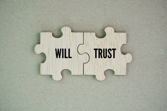 Wooden puzzle with the words will and trust. living trust might be more than you need for your situation, but it can be a great tool if you have a larger or more complex estate.