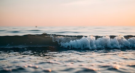 Gentle Ocean Wave at Sunset with Sparkling Water