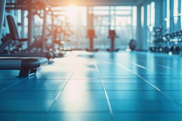 Obraz premium Modern Gym Interior: Sunlight Streaming Through Windows, Highlighting Clean Lines and Fitness Equipment