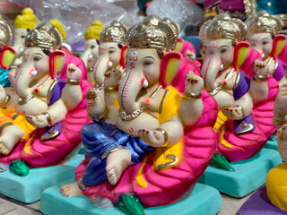Newly made idols of the God known as Ganesha or Ganapati for sale at a shop on the eve of Ganesh festival in Pune, India.