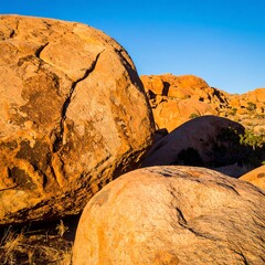 Large orange rocks in sunlight