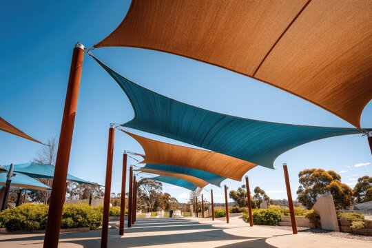 Sun-drenched walkway with modern, angled shade sails