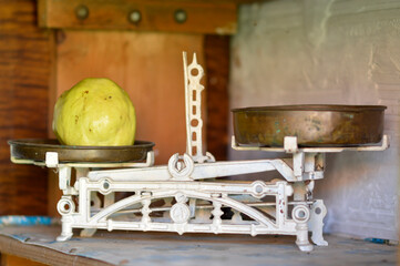 old vintage kitchen scales with glass jar and quince
