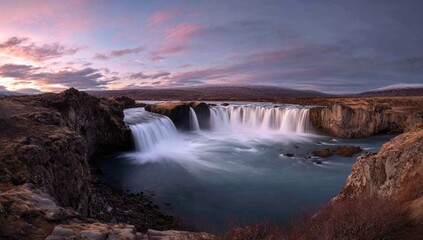 Obraz premium Majestic waterfall at dawn, dramatic colors