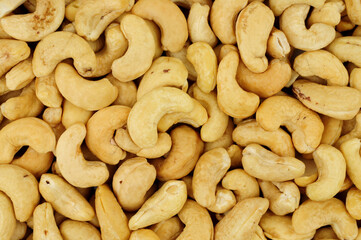 Raw shelled South American cashew nut detail texture background