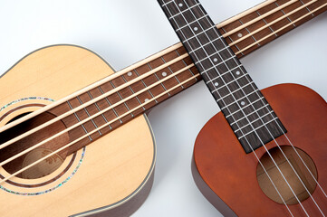 Four-string bass ukulele with wooden body and built-in tuner and pickup.