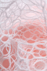 White lace with airy openwork draped over soft pink background, evoking romance and elegance; ideal...