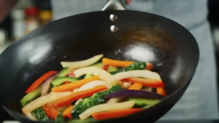 Vibrant stir-fried vegetables being tossed in a wok in a bustling kitchen setting