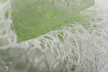 White lace with intricate net-like patterns on soft green background, evoking romantic freshness...