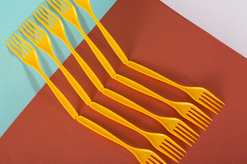 Abstract still life with yellow forks on a colorful background