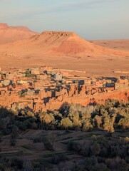 Scenic view of Ait Benhaddou, Morocco, with a desert landscape and traditional adobe buildings