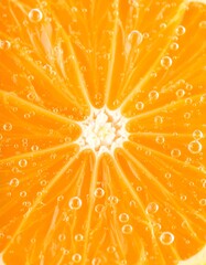 Close-up of a vibrant orange slice, showcasing its juicy segments and numerous small bubbles