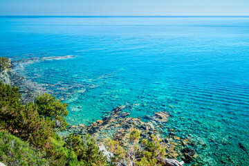 Picturesque coast of Cyprus with its turquoise waters. Landscape of the Mediterranean island seen from above, Akamas Peninsula, Neo Chorio.