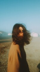 Fototapeta premium Modern Millennial Woman in Foggy Industrial Setting High-Quality Atmospheric Portrait for Lifestyle Marketing and Social Media Campaigns