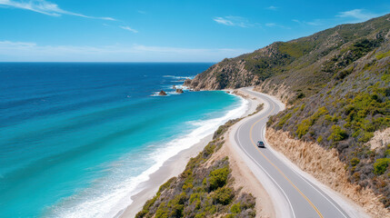 Fototapeta premium Scenic coastal road with car driving along ocean, showcasing beautiful blue waters and lush