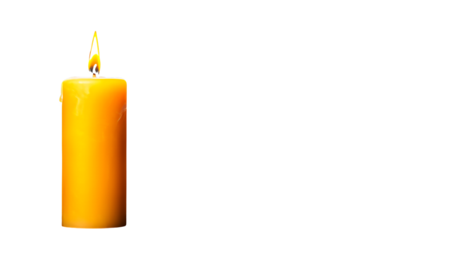Lit Yellow Candle Against Black Background