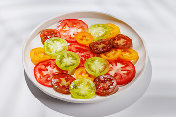 Colorful sliced tomatoes on a plate, fresh and vibrant