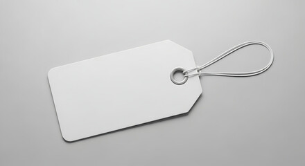 A blank white rectangular tag with a silver wire loop on a plain grey background, ready for customization.