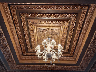 Classic chandelier hanging on cravings furniture ceiling