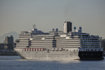 Modern luxury cruiseship cruise ship liner Koningsdam, Nieuw Statendam or Rotterdam arrival into Vancouver BC port, Canada from Alaska cruise with breathtaking nature landscape scenery