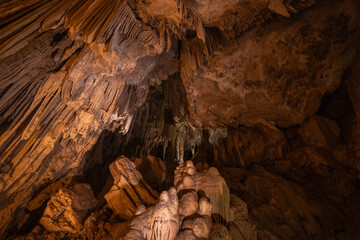 Unique rock formations create a mesmerizing underground landscape filled with stalactites and...