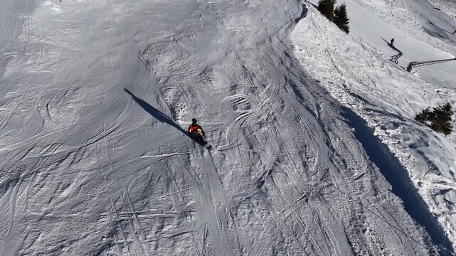 Graceful snowboarding down a wide mountain slope