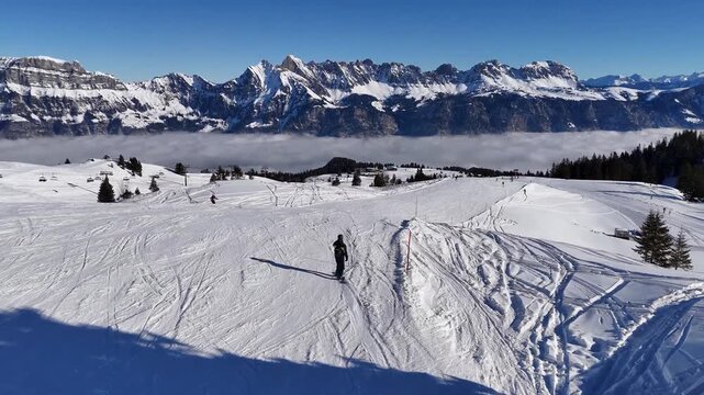 Graceful snowboarding down a wide mountain slope