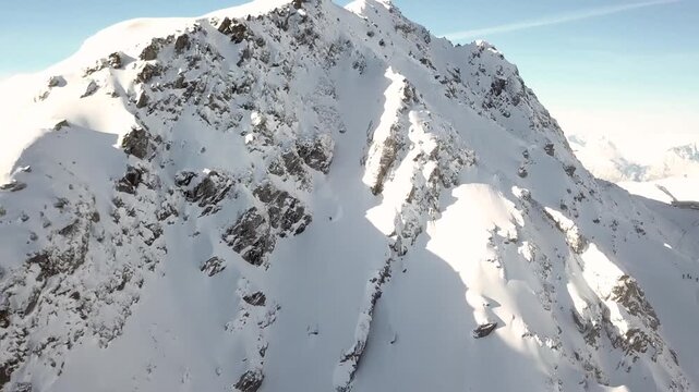 Fast, downward movement along a steep snowy mountain face
