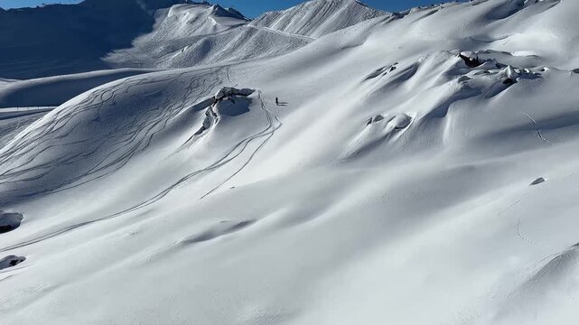 Speedy alpine skiing down a sunny mountain slope
