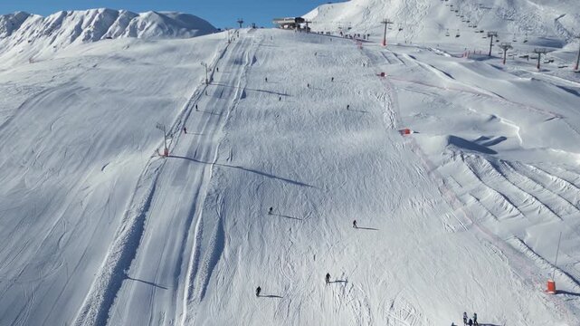 Speedy alpine skiing down a sunny mountain slope