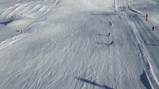 Speedy alpine skiing down a sunny mountain slope