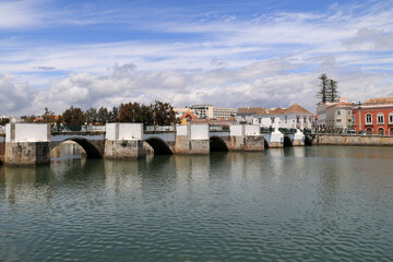 View of the Roman Bridge over the Gilao River in the Portuguese town of Tavira, Algarve, Portugal