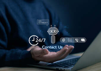 Hand holding AI chatbot contact us hologram above laptop, representing artificial intelligence, virtual communication, and automation technology for customer support and business service. smart AI
